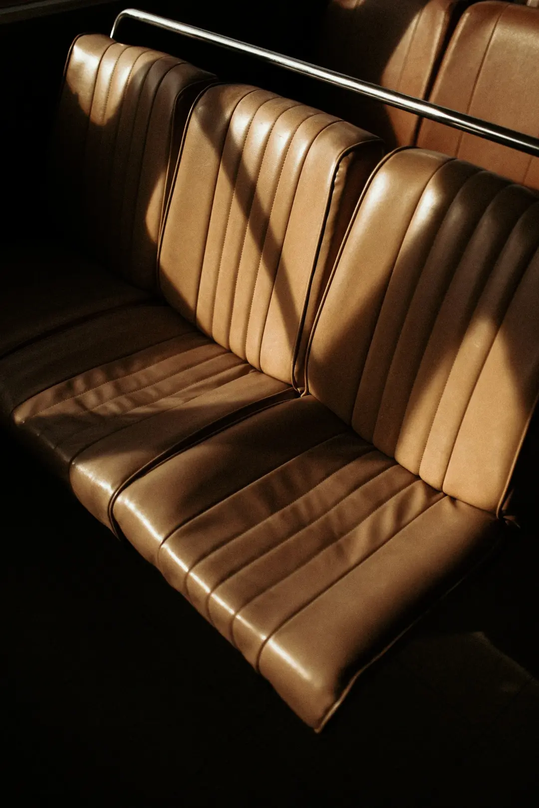 Close-up of a brown leather classic car seat
