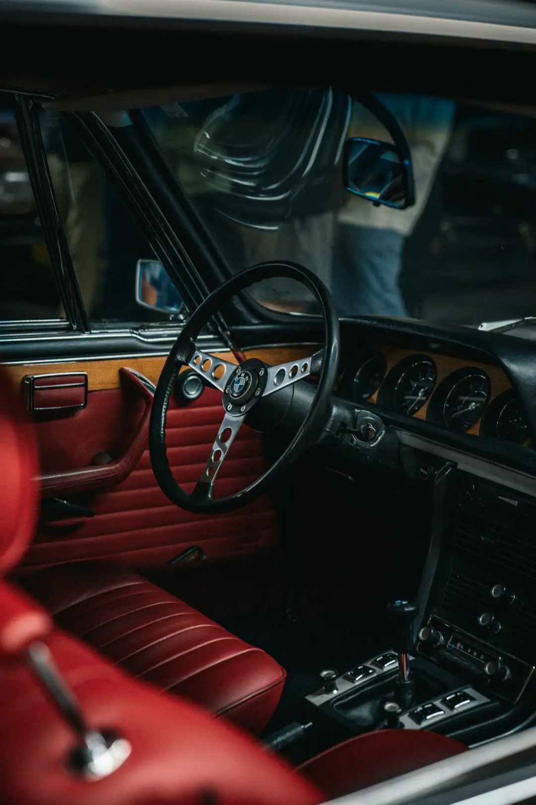 Red leather seats and door card in a classic car